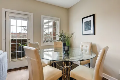 a view of a dining room with furniture and window