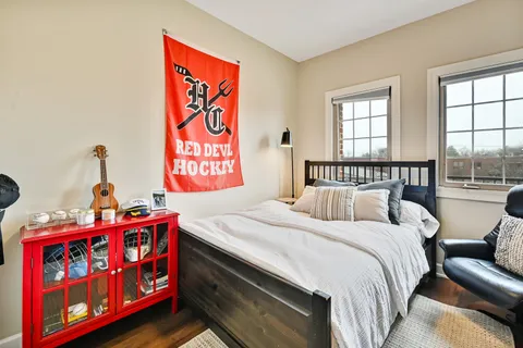 a view of a livingroom with workspace and a window