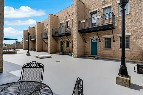 a view of a building with sitting area