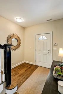 a bedroom with furniture and a wooden floor
