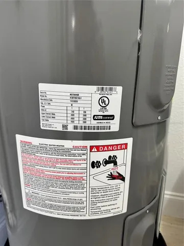 a utility room with stainless steel appliances and a counter top
