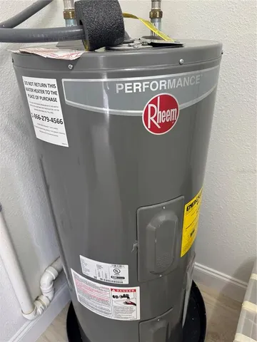 a view of a yard with wooden fence