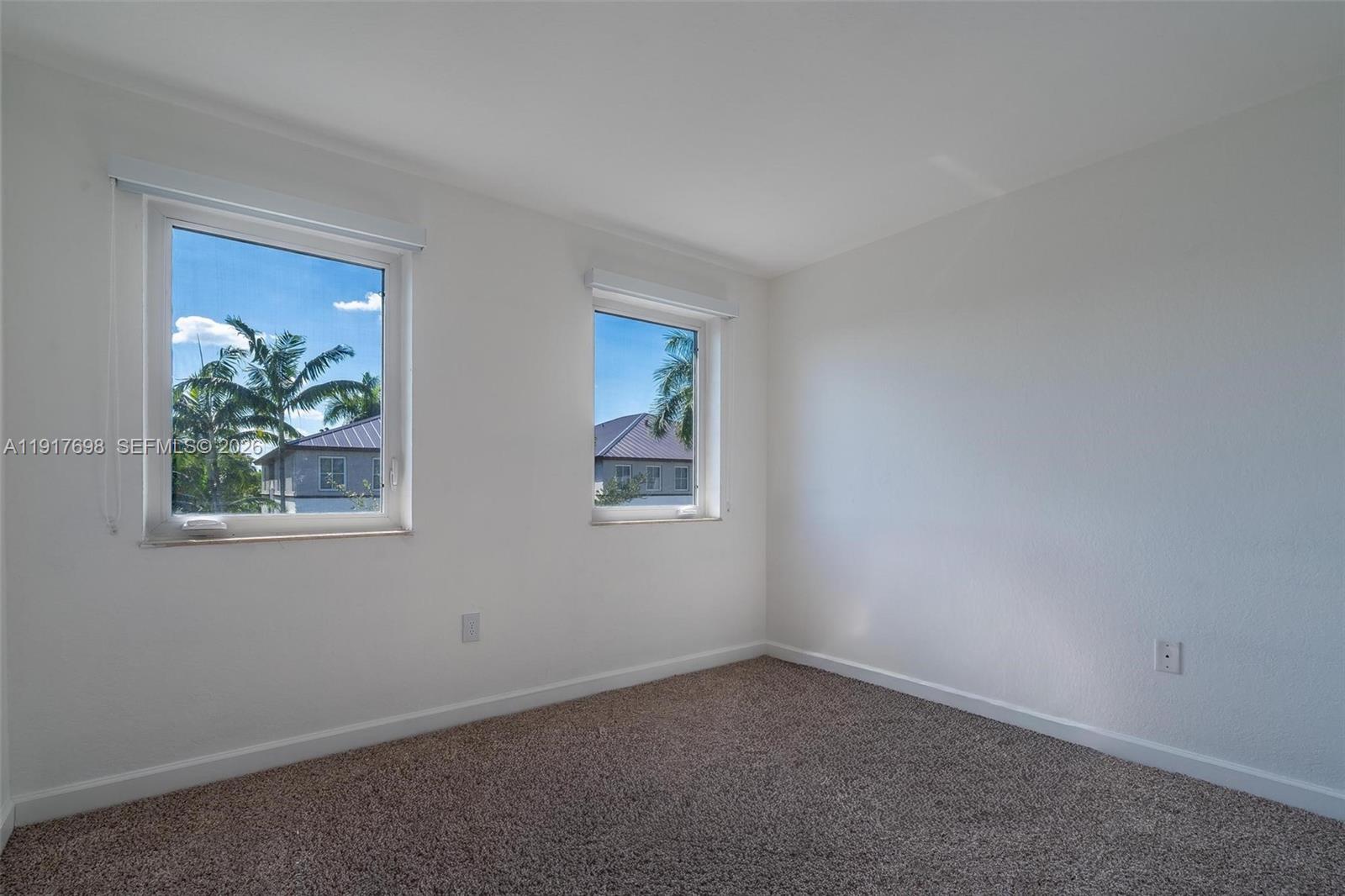 4371 Southwest 160th Avenue, Unit 211 Miramar, FL 33027 - Photo 19 of 31 an empty room with windows