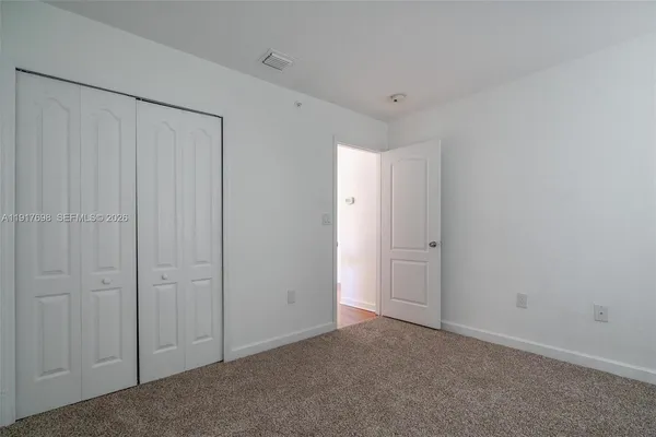 a view of a park with large trees