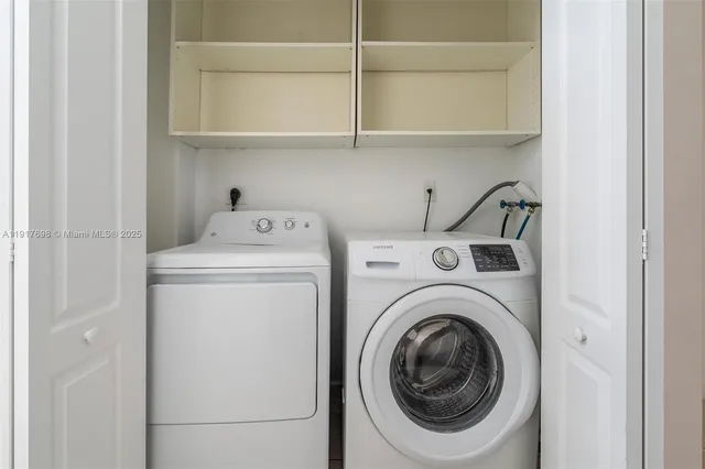 a utility room with dryer and washer