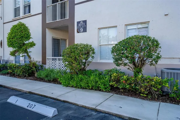 a view of a swimming pool and lounge chair