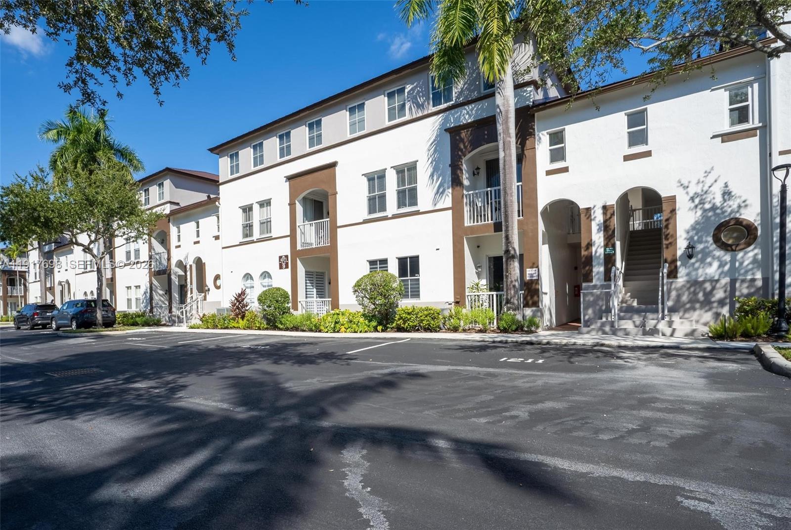 4371 Southwest 160th Avenue, Unit 211 Miramar, FL 33027 - Photo 27 of 31 a front view of a building with street view