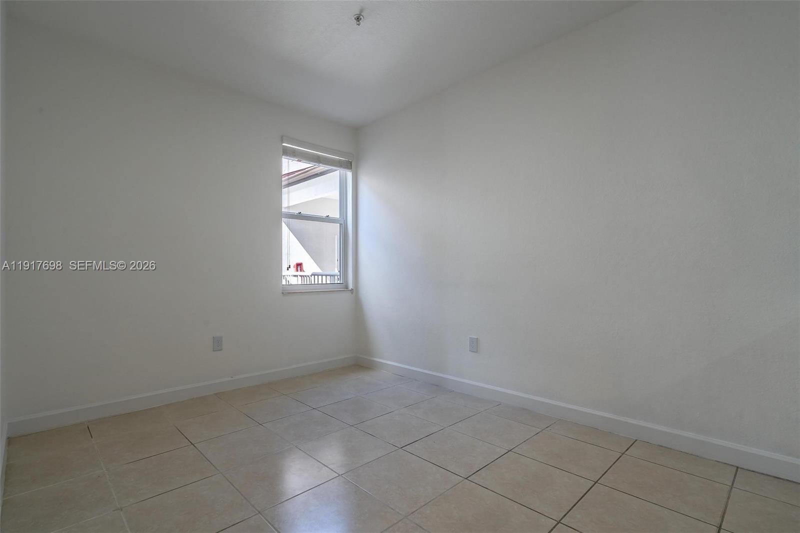 4371 Southwest 160th Avenue, Unit 211 Miramar, FL 33027 - Photo 9 of 31 an empty room with windows