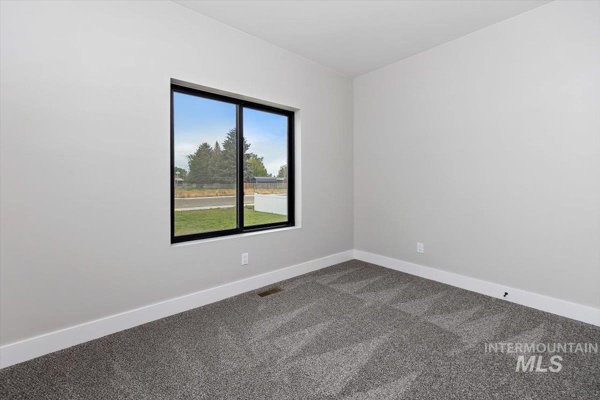 1201 Jade Drive Rupert, ID 83350 - Photo 23 of 27 Contemporary window with black framing, set against light gray walls and white baseboards