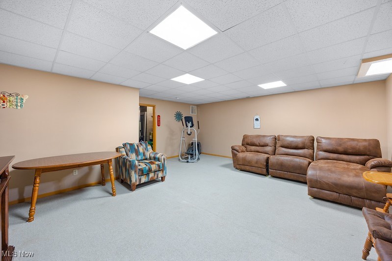 1035 Parsons Road Grafton, OH 44044 - Photo 17 of 25 Carpeted living room with a drop ceiling
