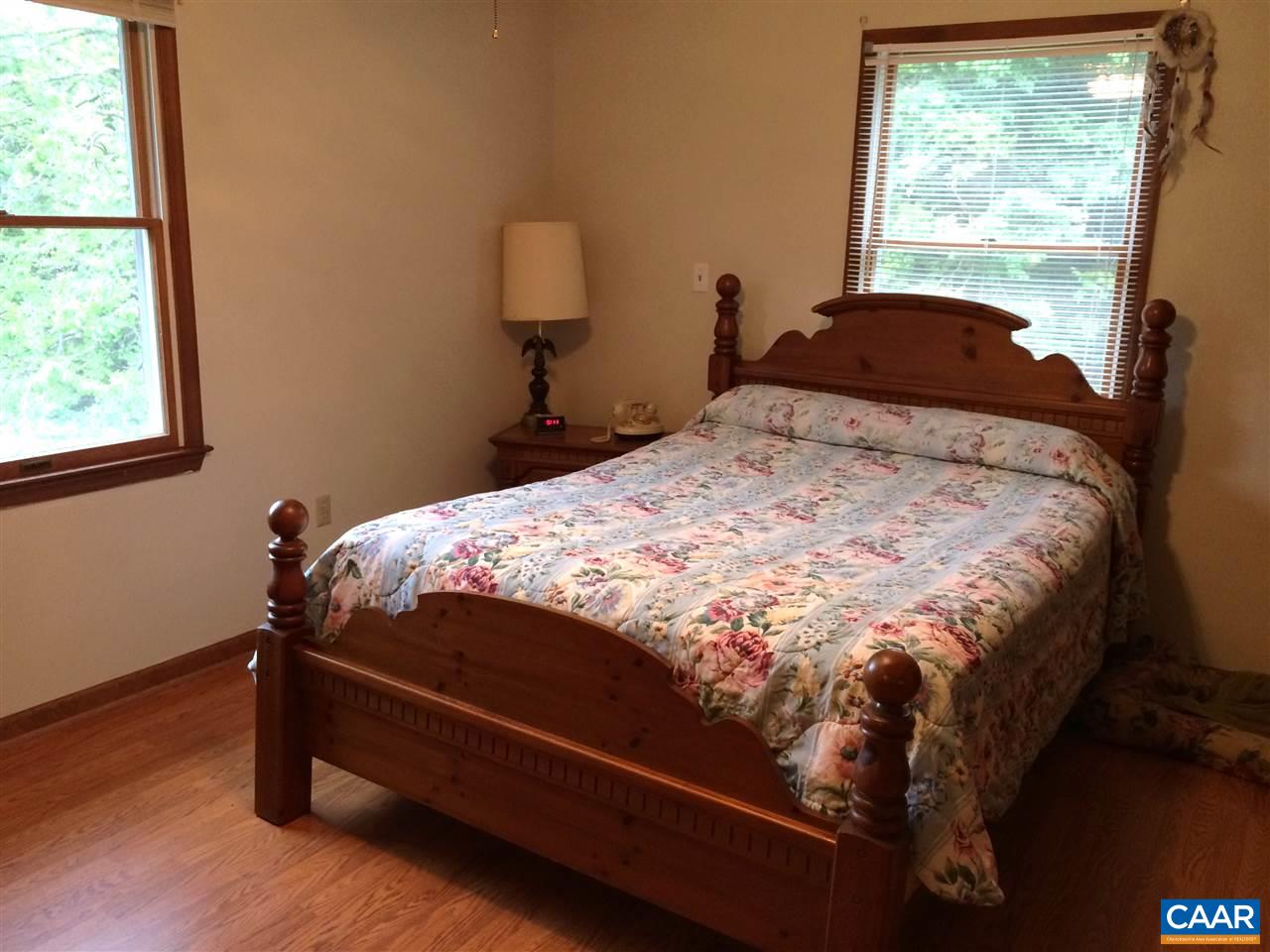 2351 Dunnes Shop Road Ruckersville, VA 22968 - Photo 8 of 8 a bedroom with a bed and a window