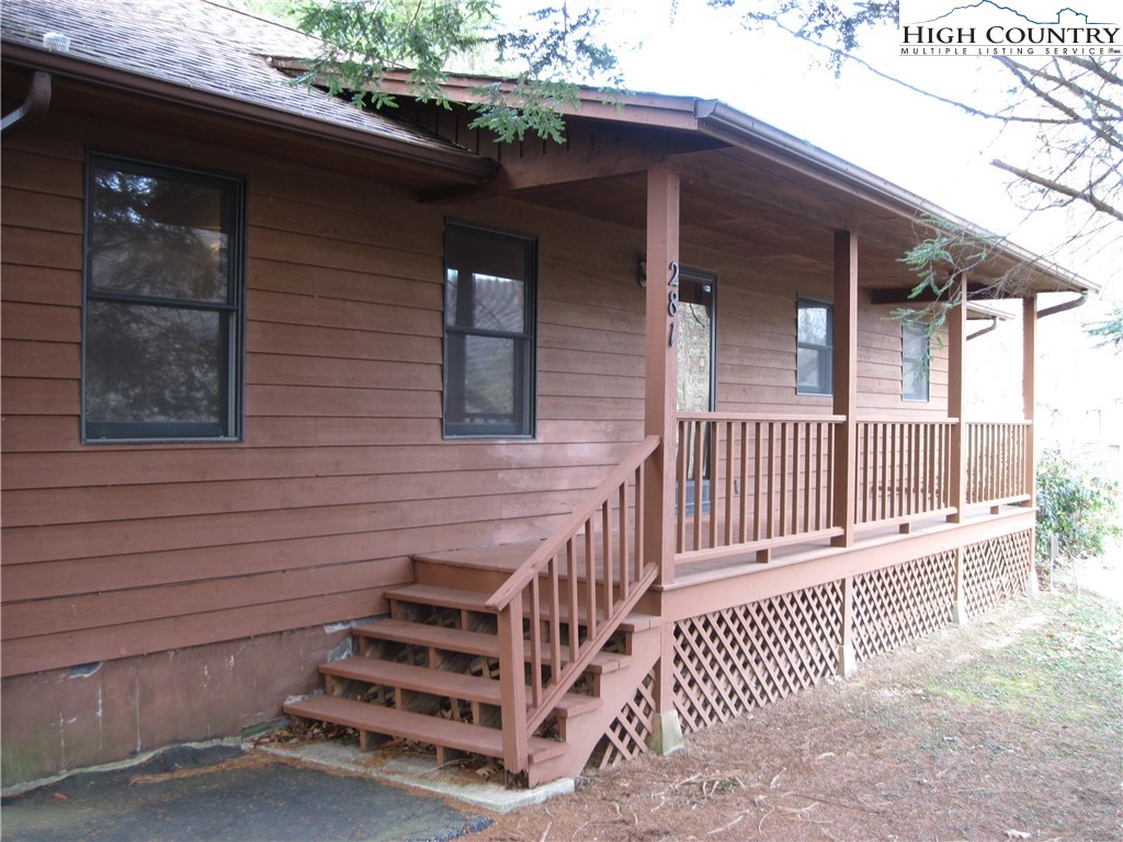a view of a deck with a large window