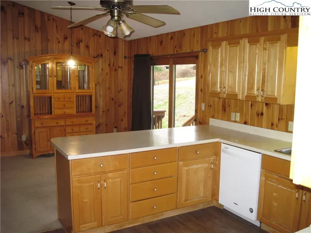 a bathroom with a sink a large mirror and a shower