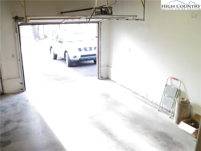 a view of a living room with furniture and a window