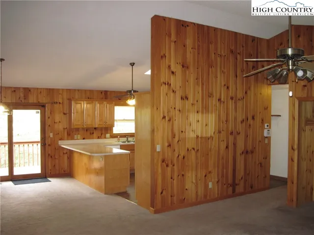 a view of a kitchen with a sink and cabinets