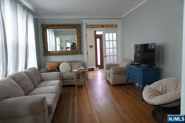 88 Shaler Avenue Fairview, NJ 07022 - Photo 11 of 22 a living room with furniture and a flat screen tv