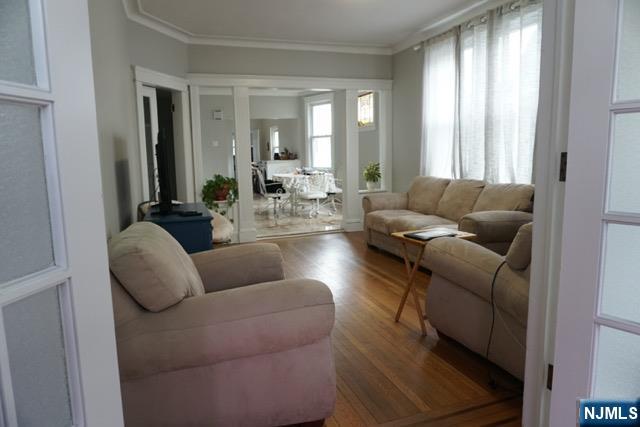 88 Shaler Avenue Fairview, NJ 07022 - Photo 9 of 22 a living room with furniture and a large window