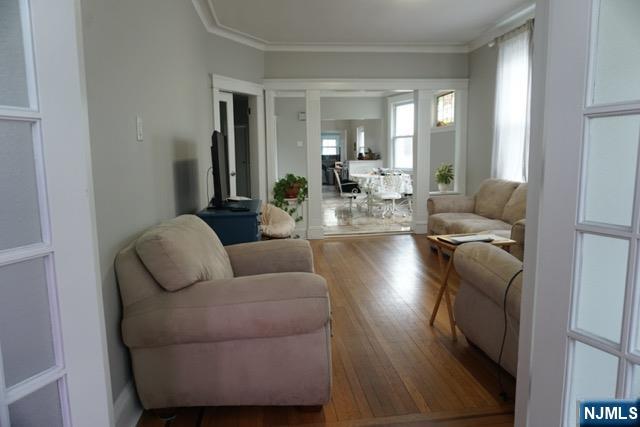 88 Shaler Avenue Fairview, NJ 07022 - Photo 10 of 22 a living room with furniture and a wooden floor