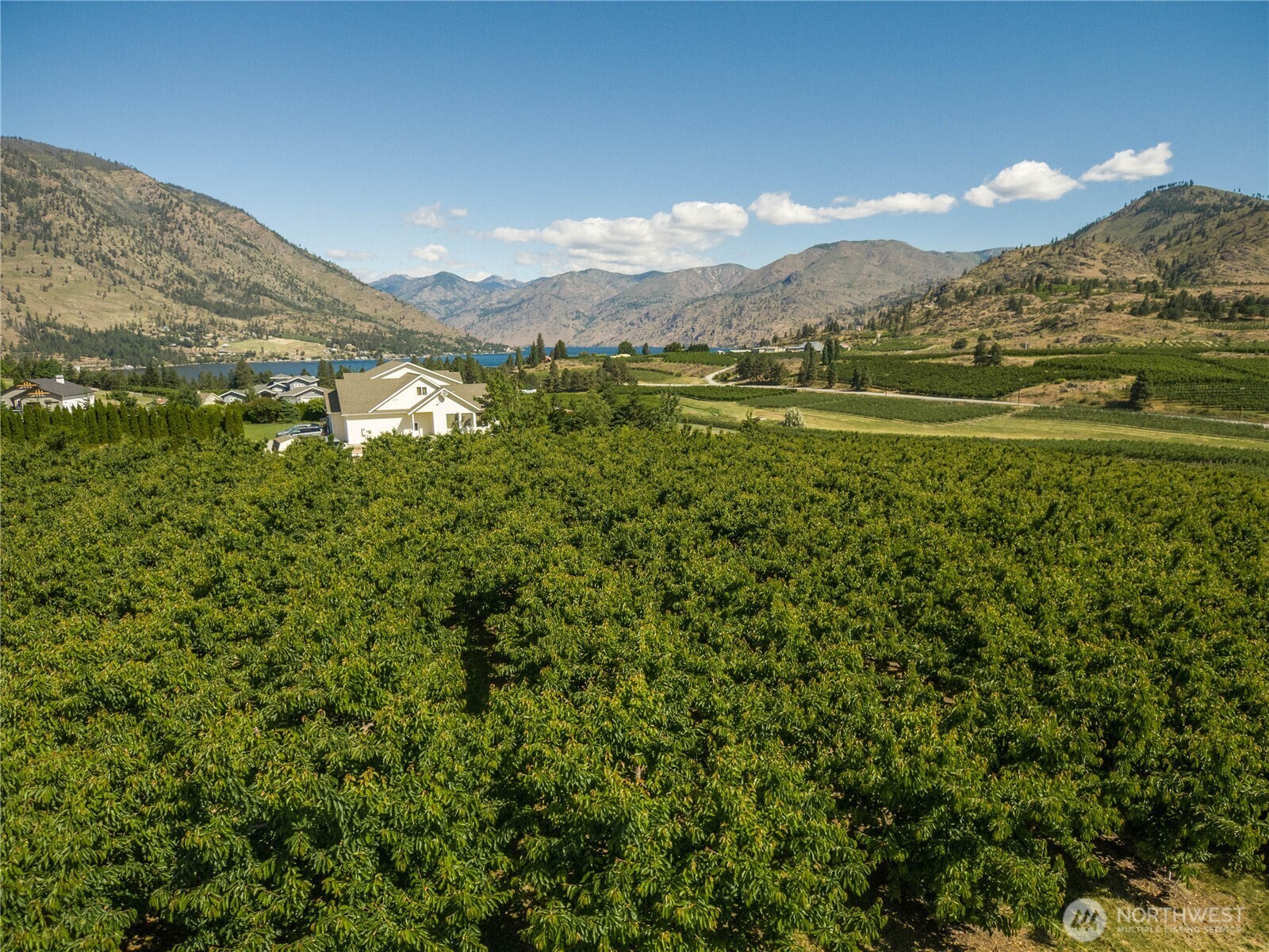 950 Loop Avenue Manson, WA 98831 - Photo 11 of 14 a view of a town with mountains in the background