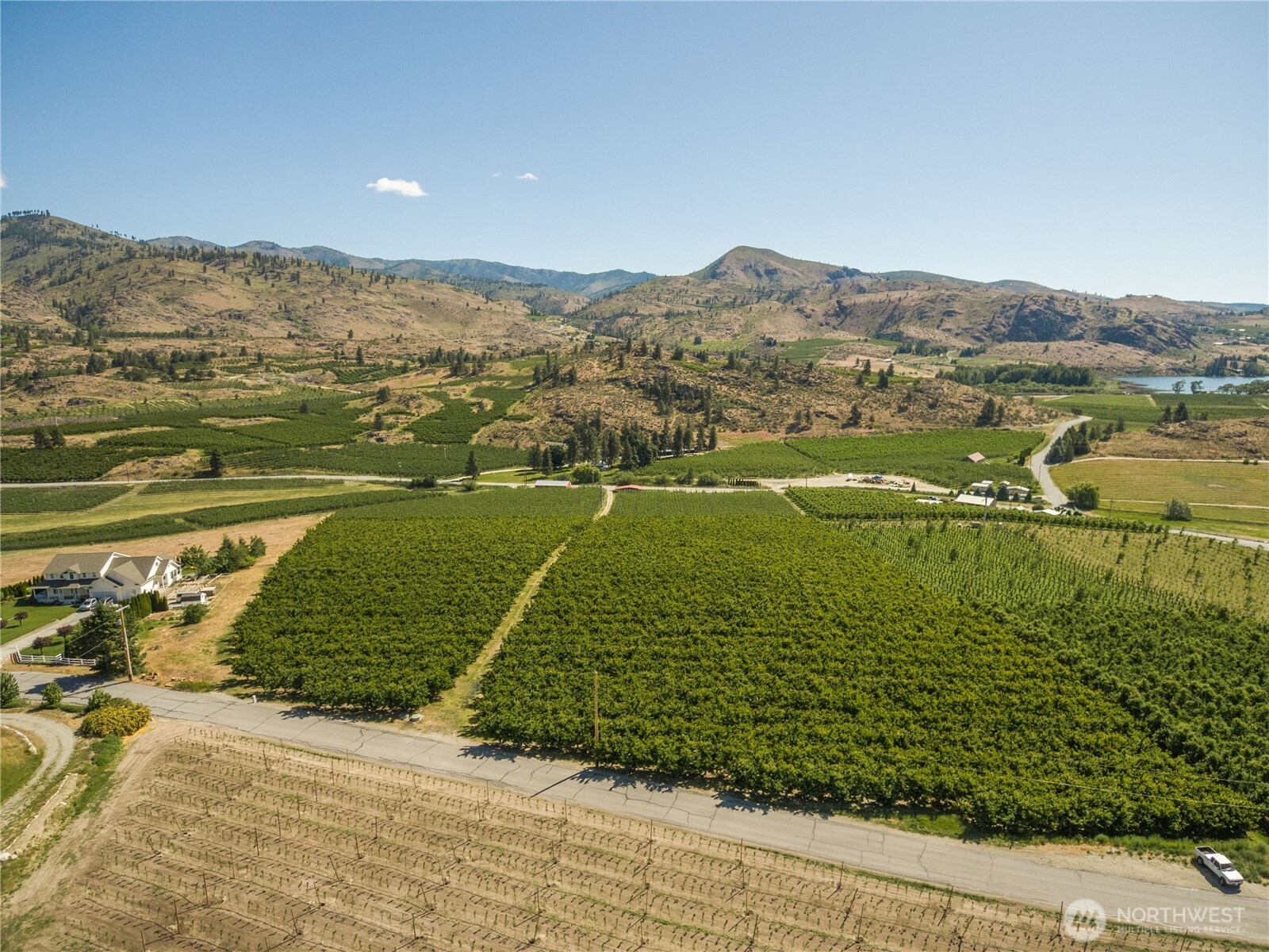 950 Loop Avenue Manson, WA 98831 - Photo 8 of 14 a view of a lake with a mountain
