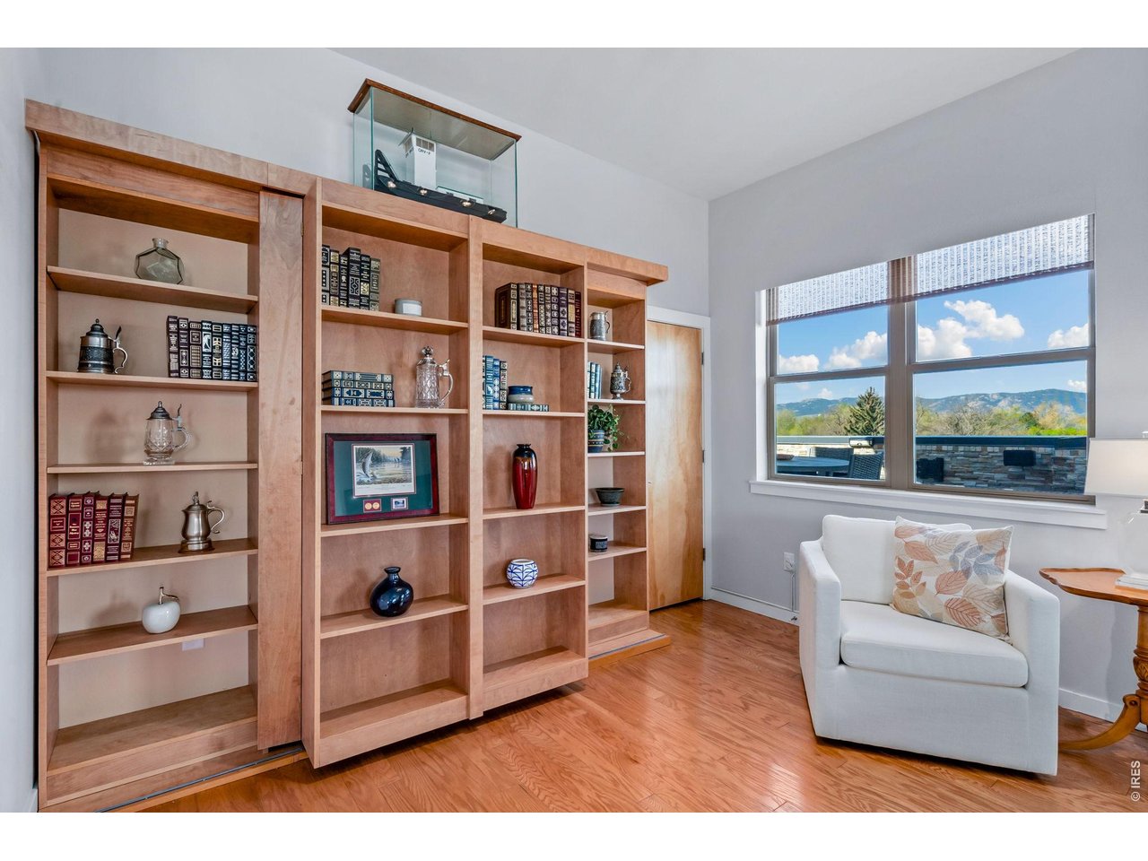 204 Maple Street, Unit 401 Fort Collins, CO 80521 - Photo 20 of 47 a living room with furniture and a book shelf