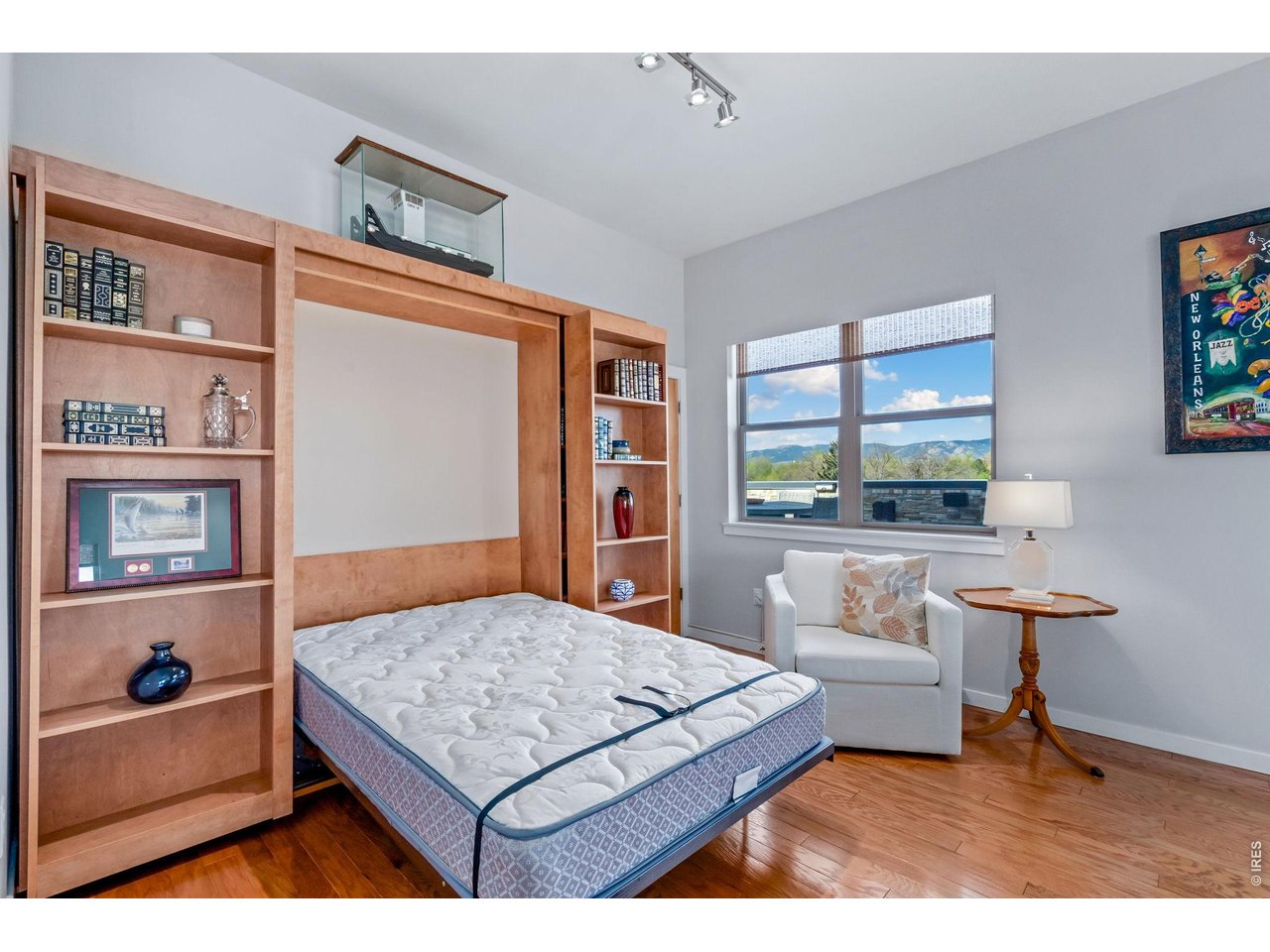 204 Maple Street, Unit 401 Fort Collins, CO 80521 - Photo 21 of 47 a bedroom with a bed and a table in it