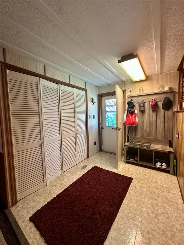381 Red Oak Lane Bath, PA 18014 - Photo 23 of 27 A welcoming entryway with practical closet storage and durable vinyl flooring.