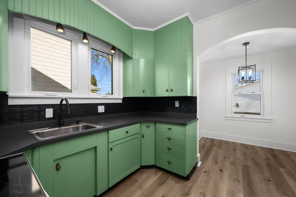 a kitchen with lots of counter space and a window