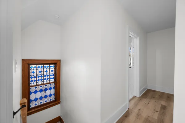 a view of a hallway with windows