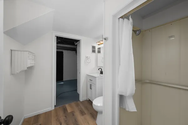 a view of a bathroom with a walk in closet