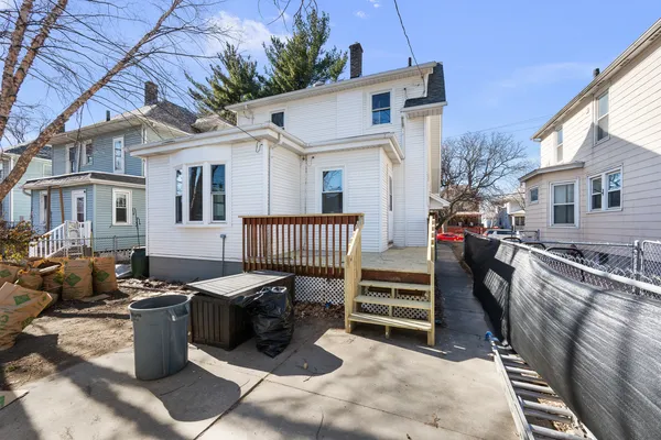 a view of a patio with a chairs and table in a patio