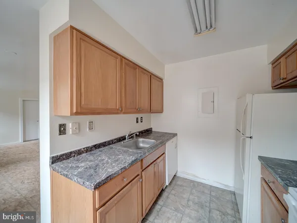 a kitchen that has a sink and a stove