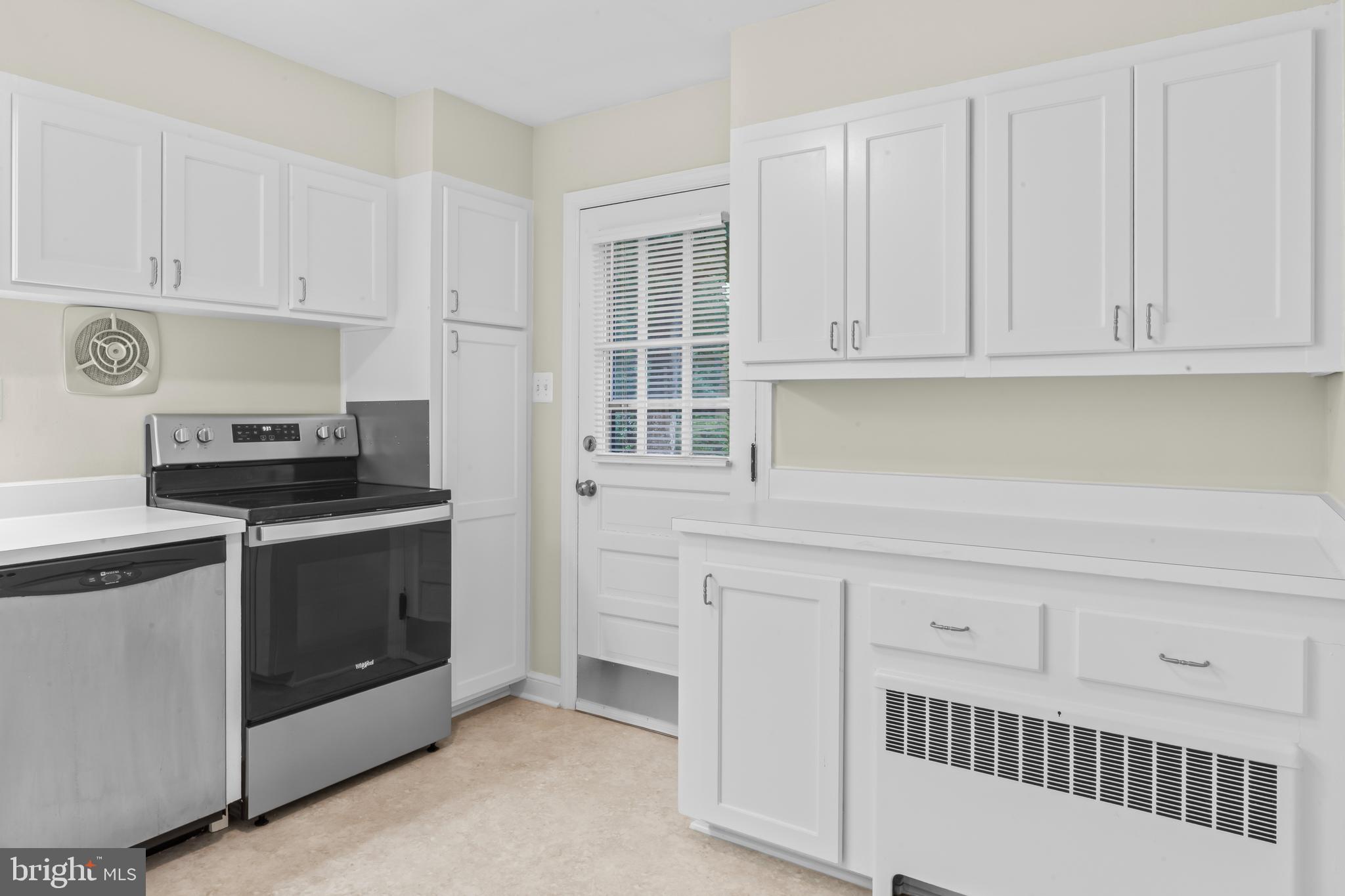 12131 Waples Mill Road Oakton, VA 22124 - Photo 14 of 40 a kitchen with white cabinets and sink