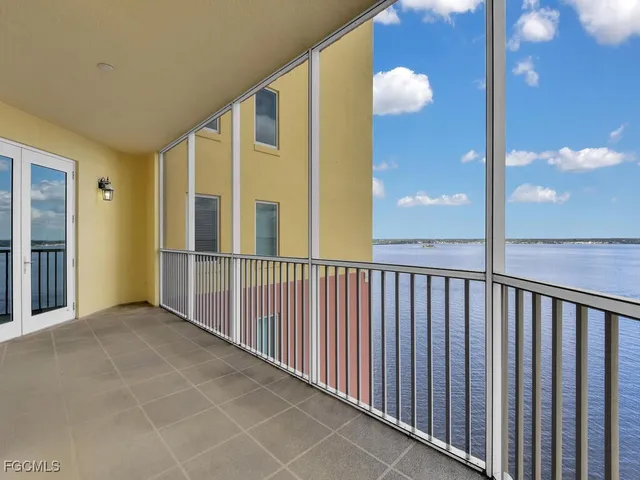 an outdoor space with pool and furniture