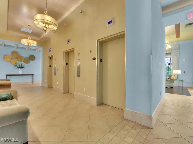 a view of a room with furniture and wooden floor