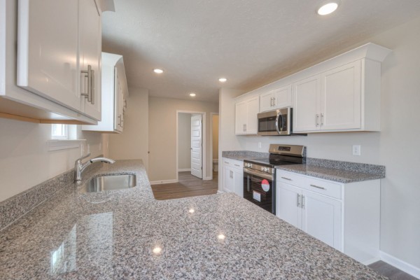 6 Laurel View Street Manchester, TN 37355 - Photo 6 of 11 a kitchen with stainless steel appliances granite countertop a sink a stove and a refrigerator
