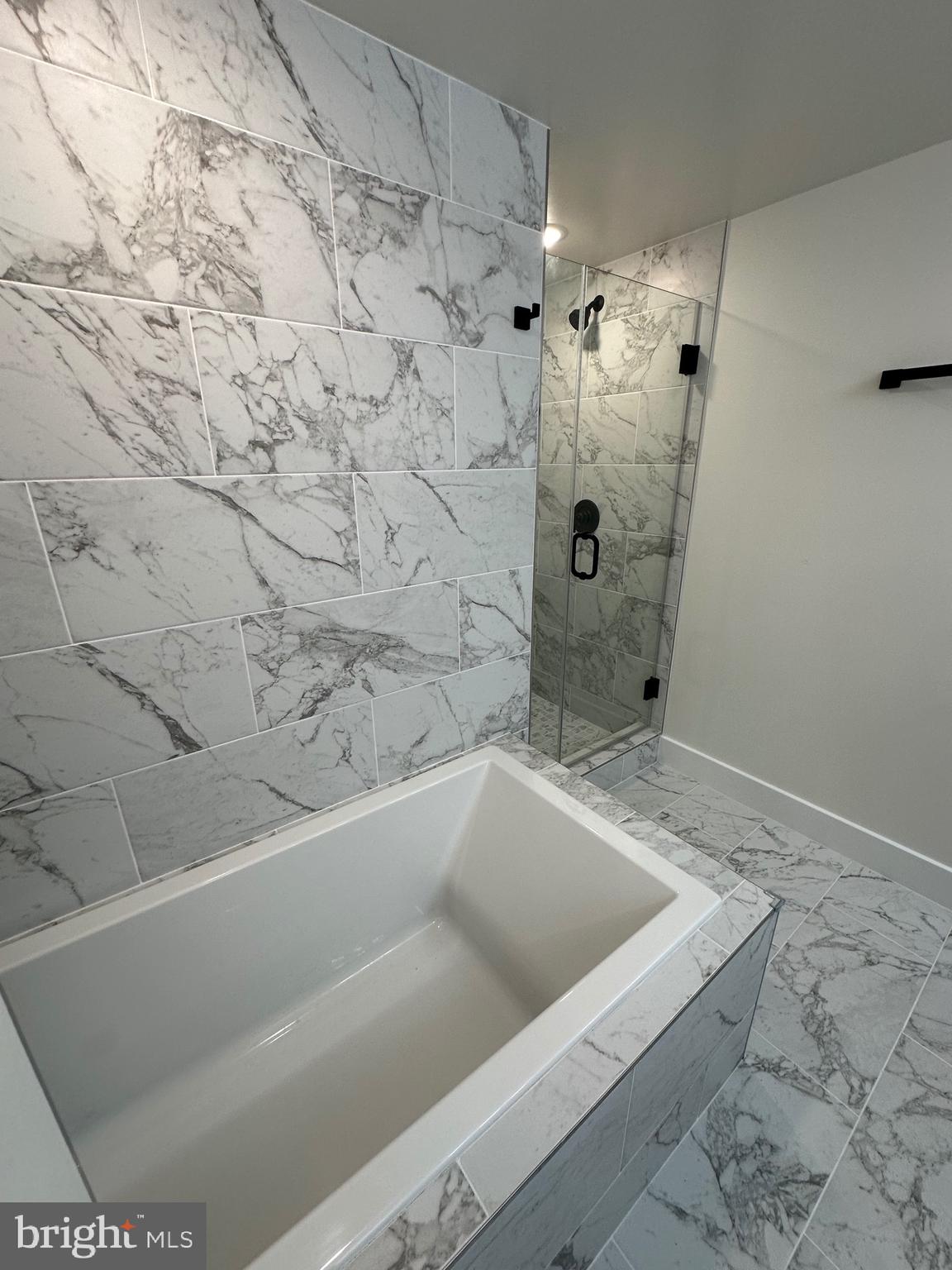 3210 8th Street Southeast, Unit 1 Washington, DC 20032 - Photo 14 of 14 a bathroom with a bathtub and shower