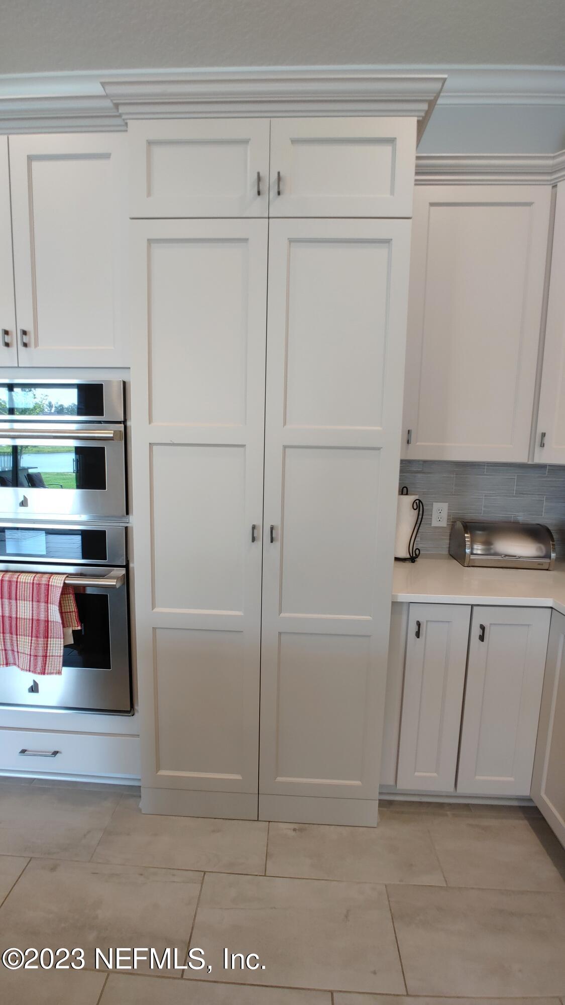 133 Pavati Point St. Johns, FL 32259 - Photo 16 of 46 a view of cabinets and refrigerator