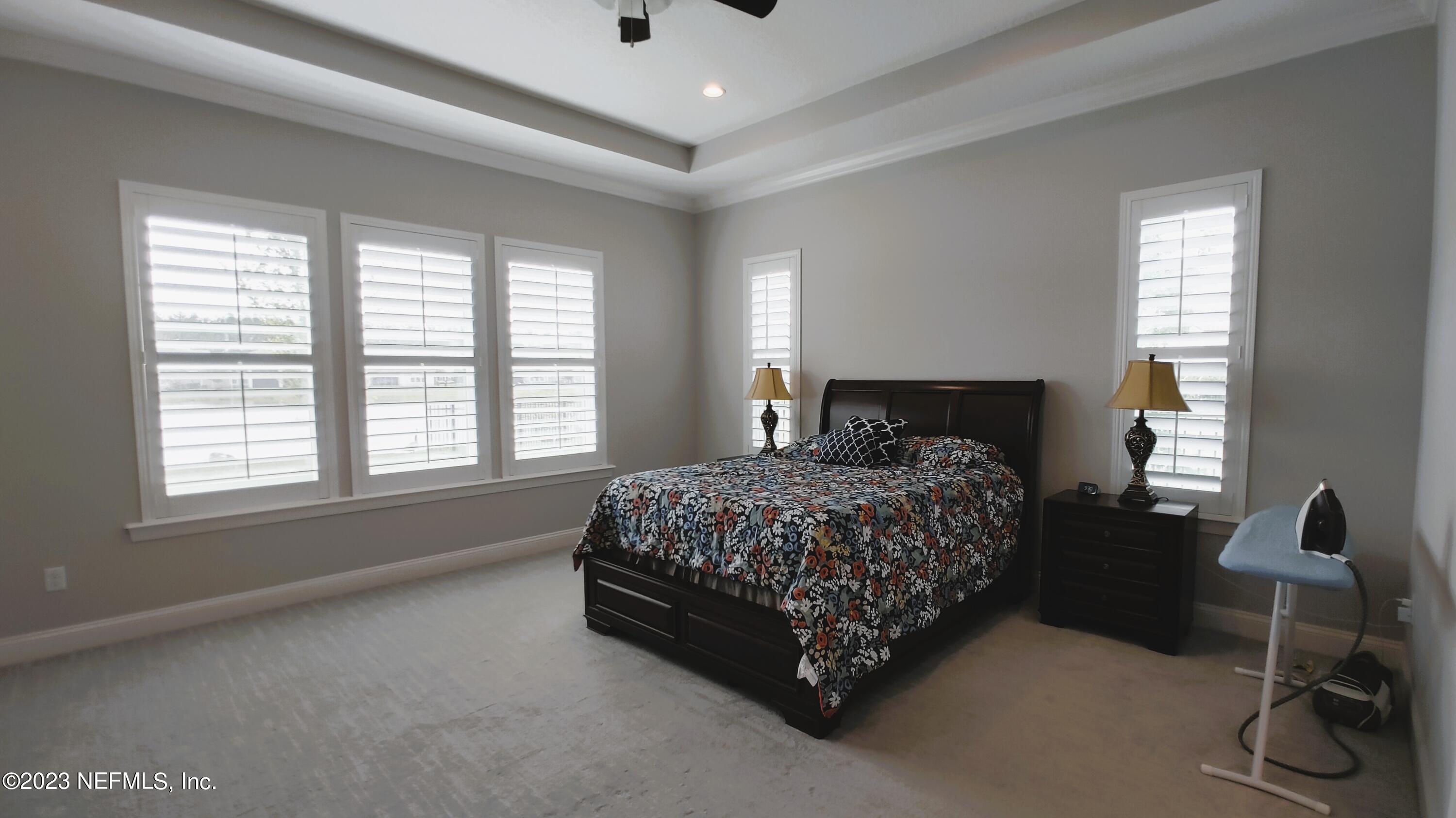 133 Pavati Point St. Johns, FL 32259 - Photo 20 of 46 a spacious bedroom with a bed and a window