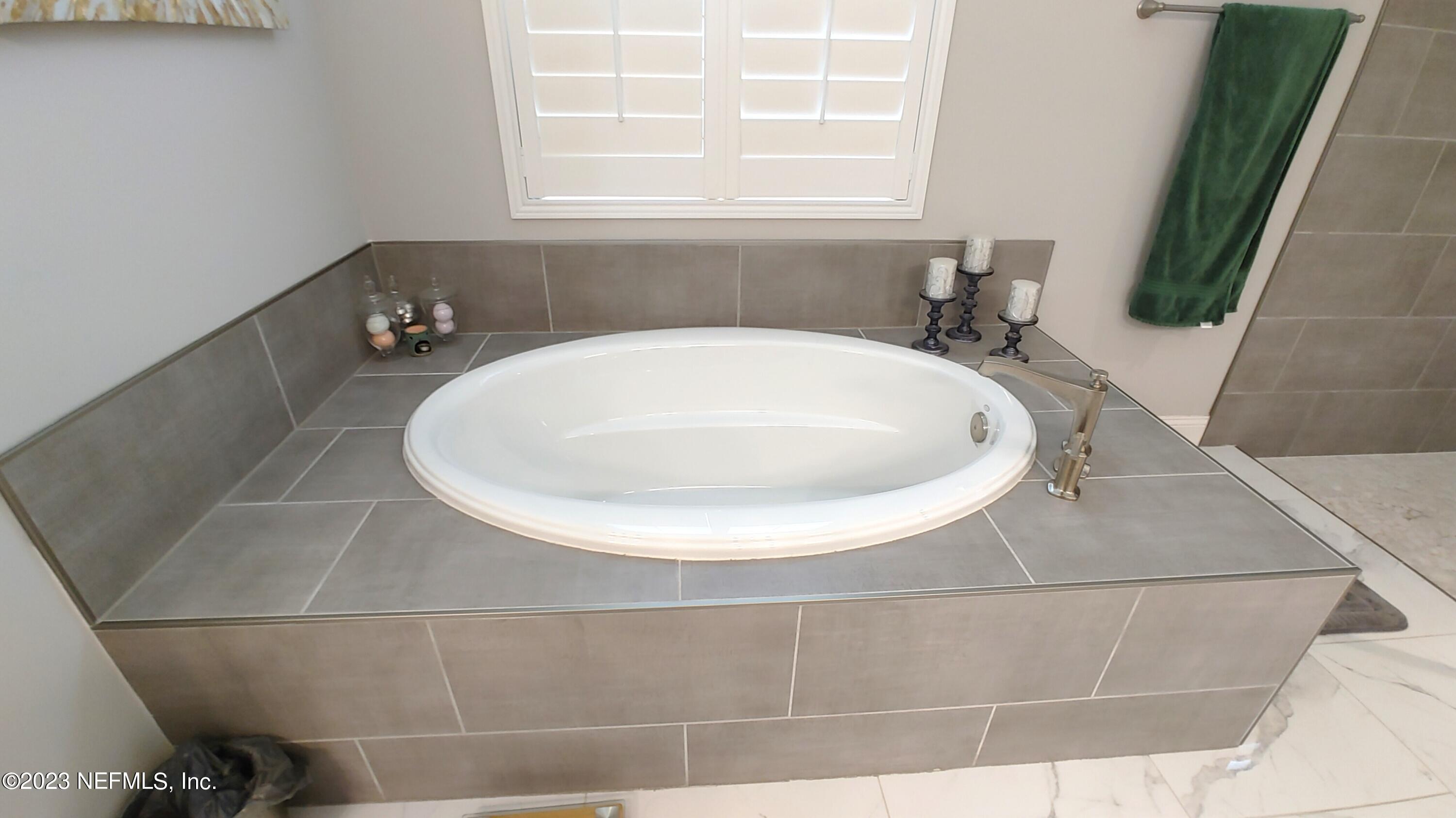 133 Pavati Point St. Johns, FL 32259 - Photo 24 of 46 a bathroom with a sink and a window