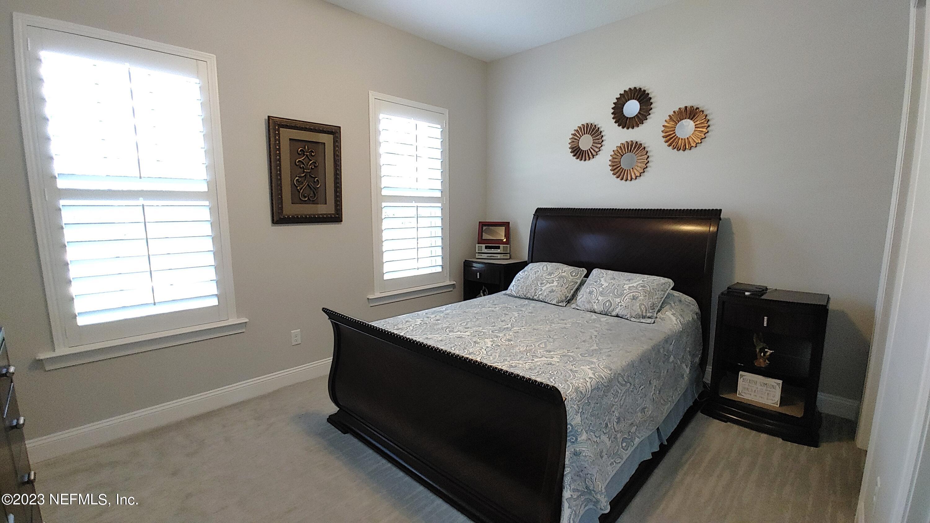 133 Pavati Point St. Johns, FL 32259 - Photo 3 of 46 a bedroom with a bed and a window