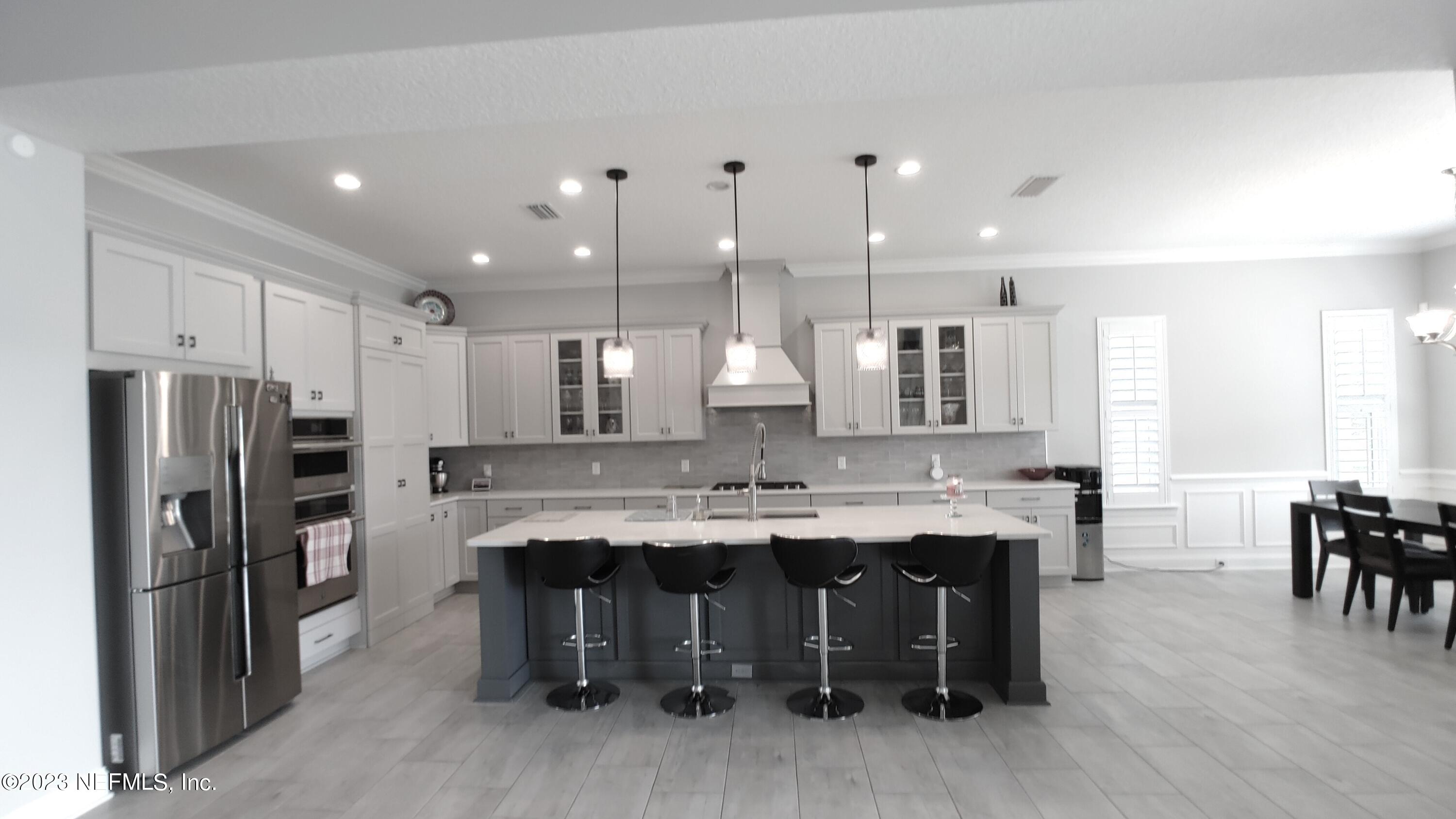 133 Pavati Point St. Johns, FL 32259 - Photo 31 of 46 a large kitchen with a table and chairs