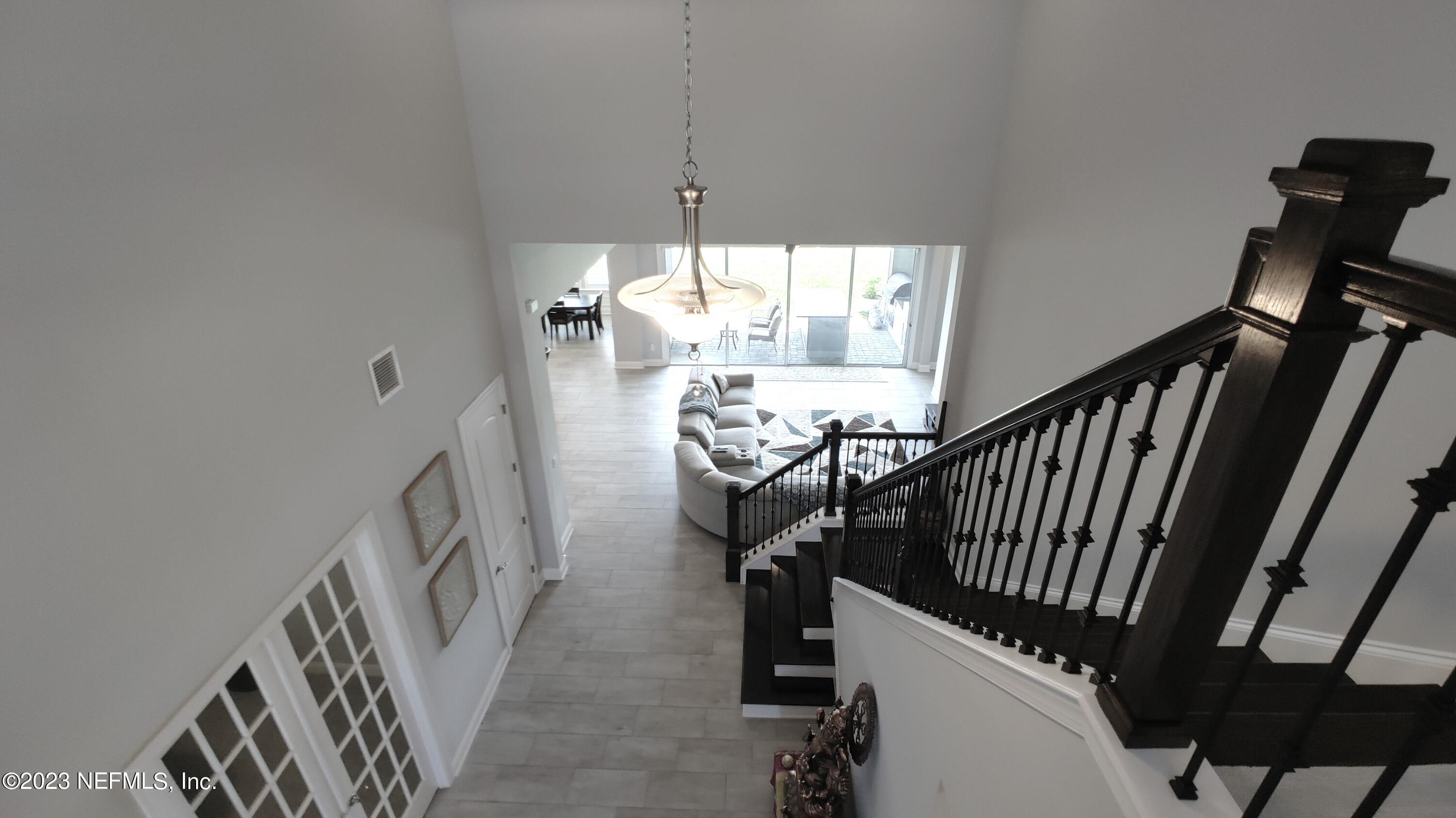 133 Pavati Point St. Johns, FL 32259 - Photo 33 of 46 a view of an entryway wooden floor and chandelier