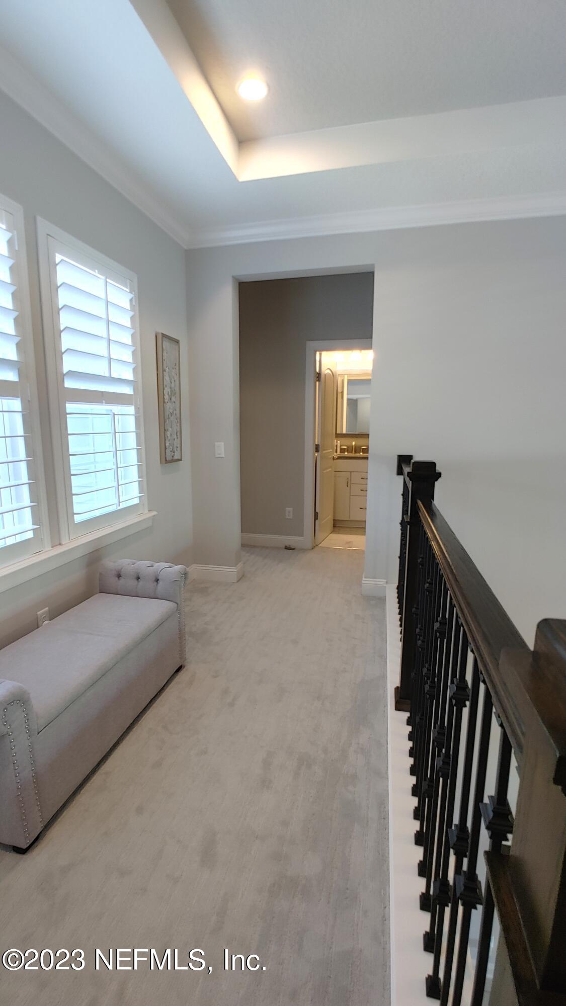 133 Pavati Point St. Johns, FL 32259 - Photo 34 of 46 a spacious bedroom with a bed and a large window