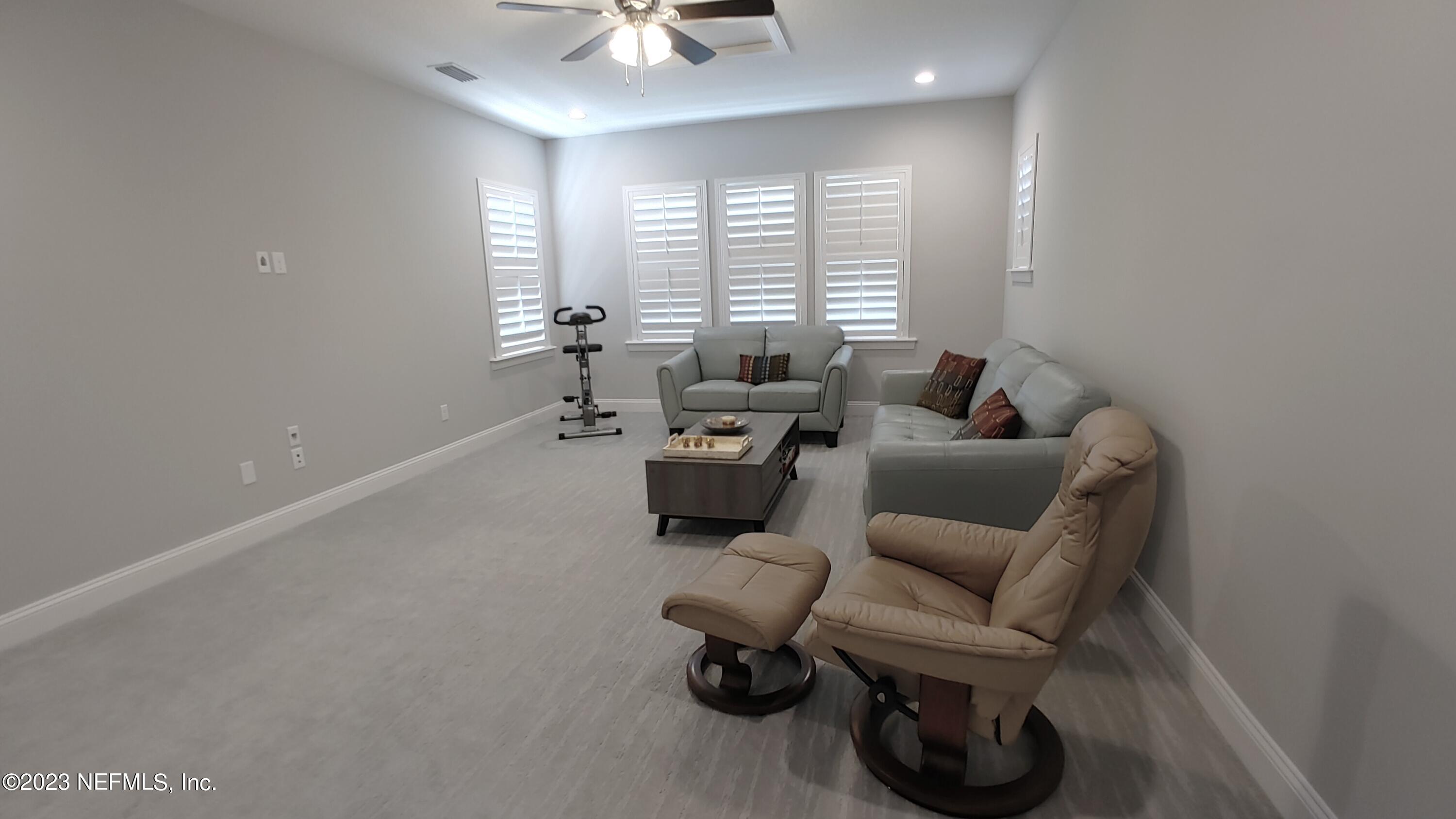 133 Pavati Point St. Johns, FL 32259 - Photo 36 of 46 a living room with furniture and a large window