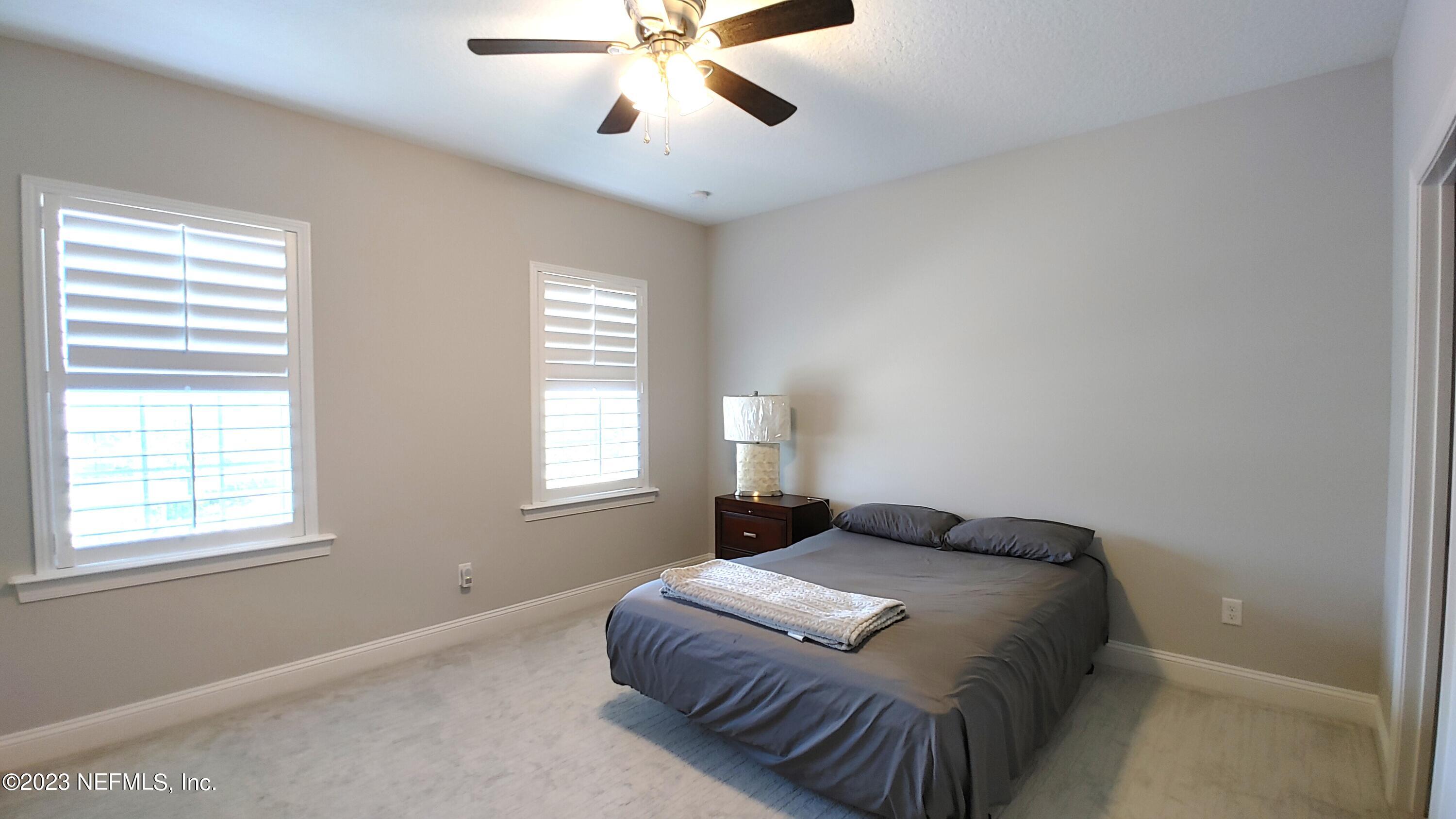 133 Pavati Point St. Johns, FL 32259 - Photo 37 of 46 a bedroom with a bed and window