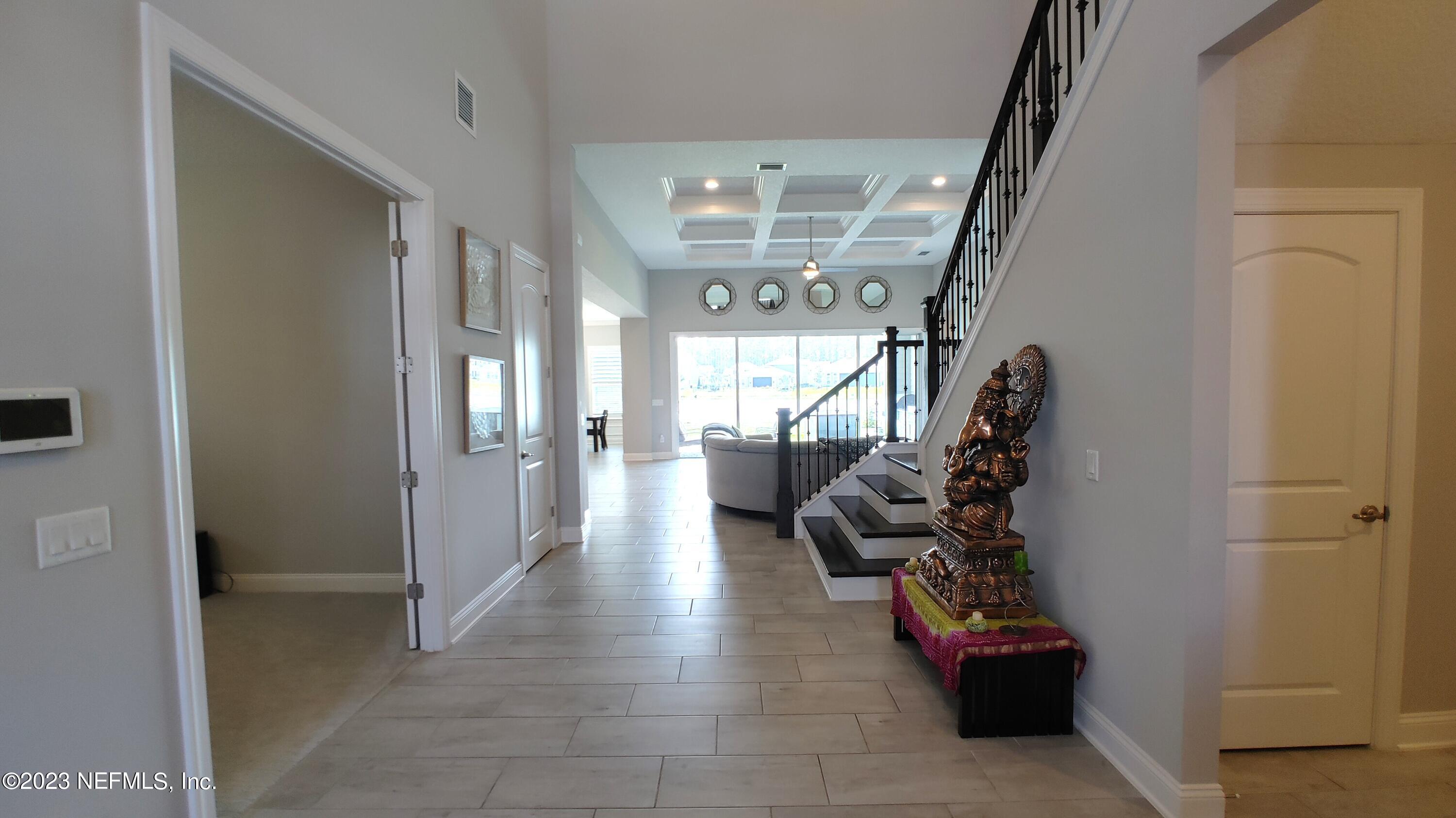 133 Pavati Point St. Johns, FL 32259 - Photo 4 of 46 a hallway with toys and stairs