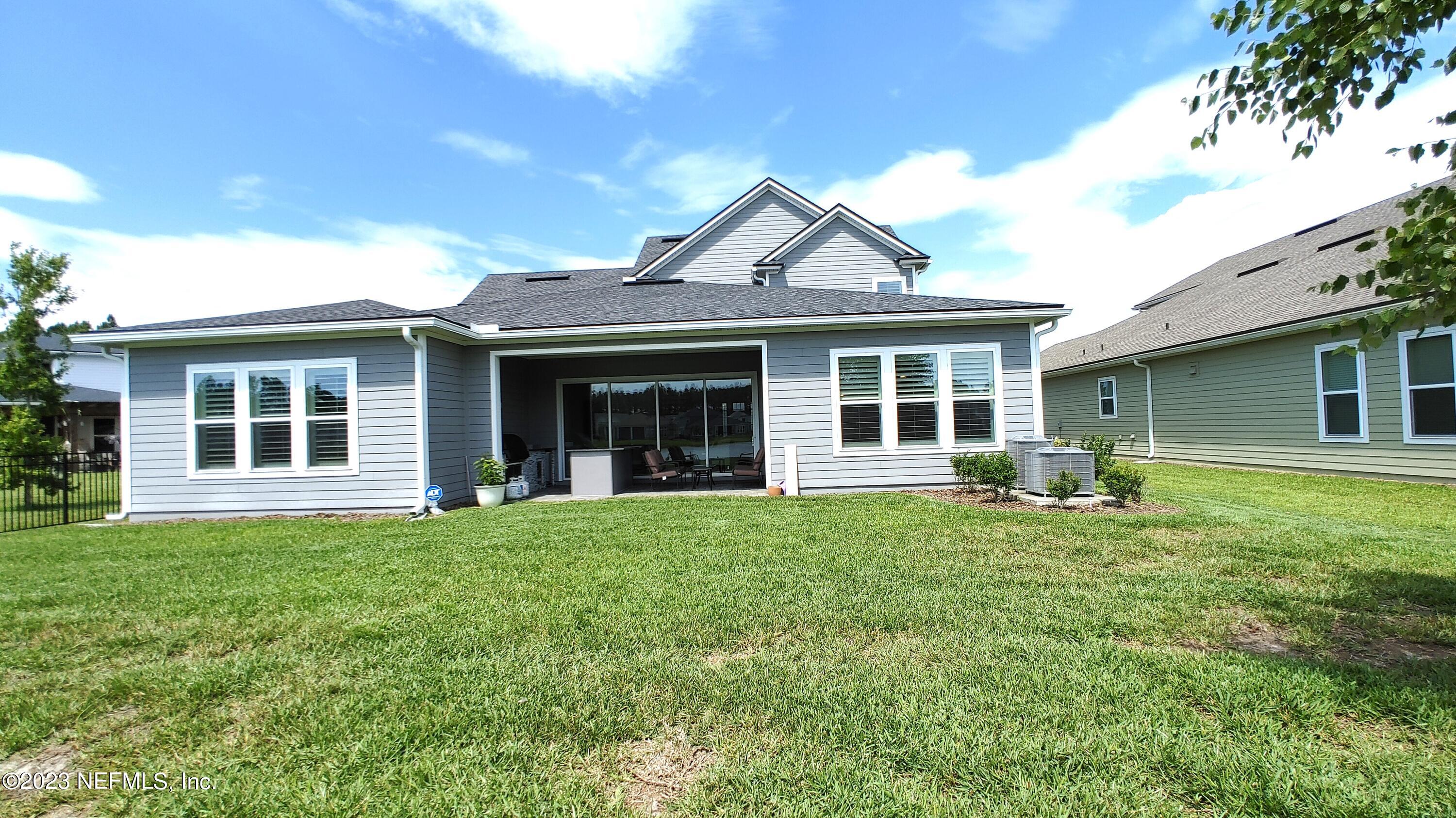 133 Pavati Point St. Johns, FL 32259 - Photo 43 of 46 a front view of a house with a garden