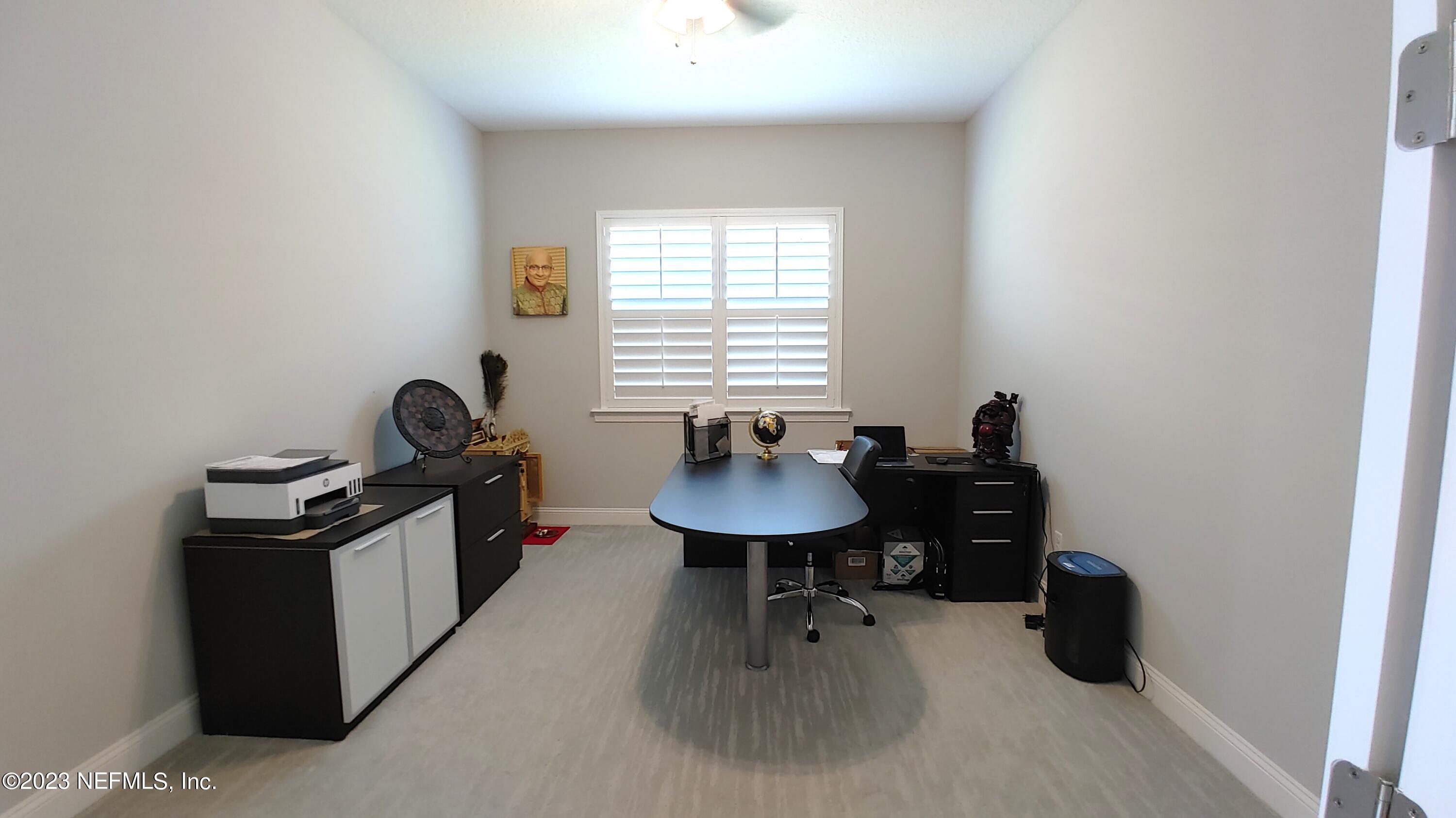 133 Pavati Point St. Johns, FL 32259 - Photo 7 of 46 a view of a workspace with furniture and a window