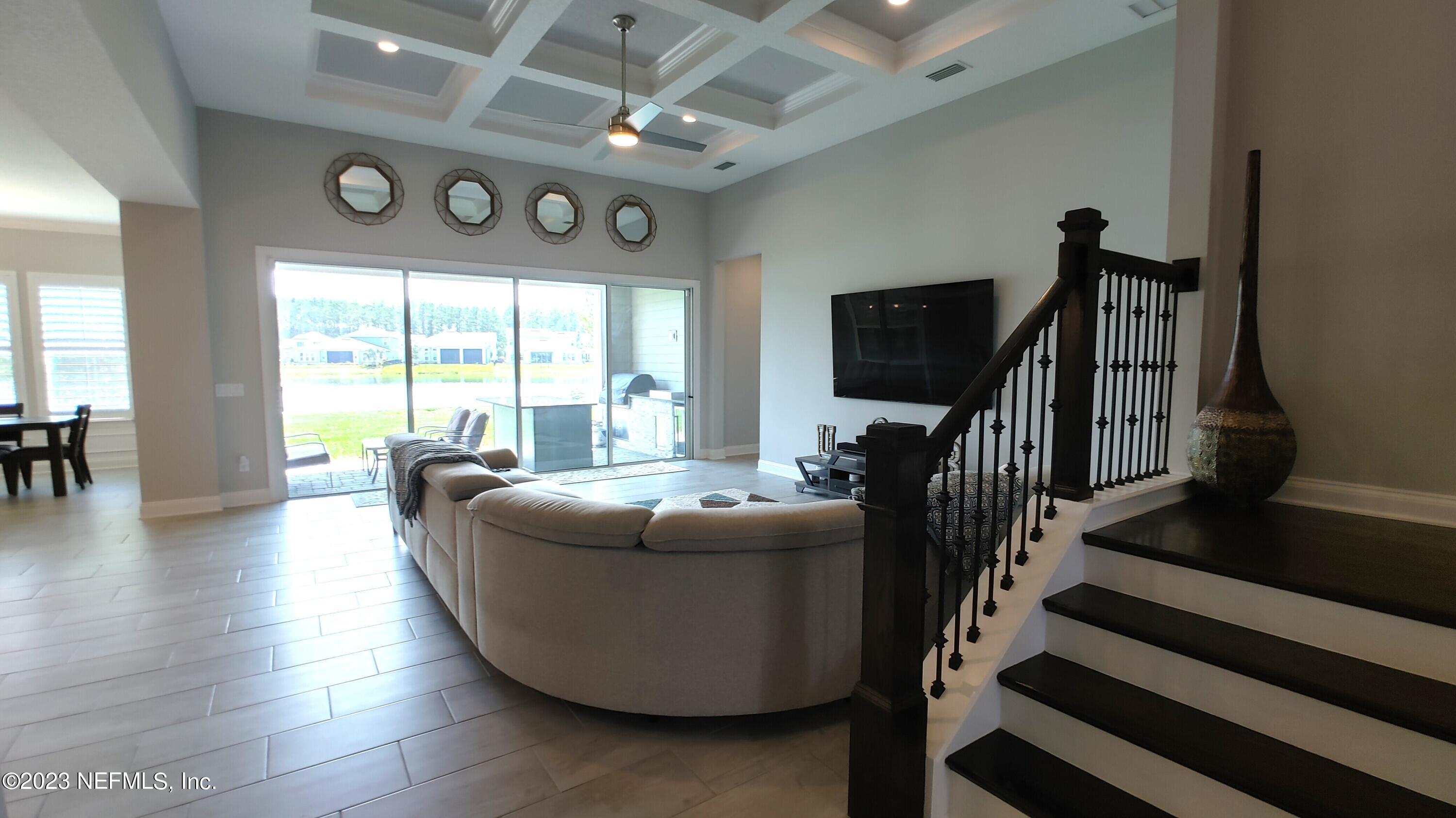 133 Pavati Point St. Johns, FL 32259 - Photo 8 of 46 a living room with furniture and a flat screen tv